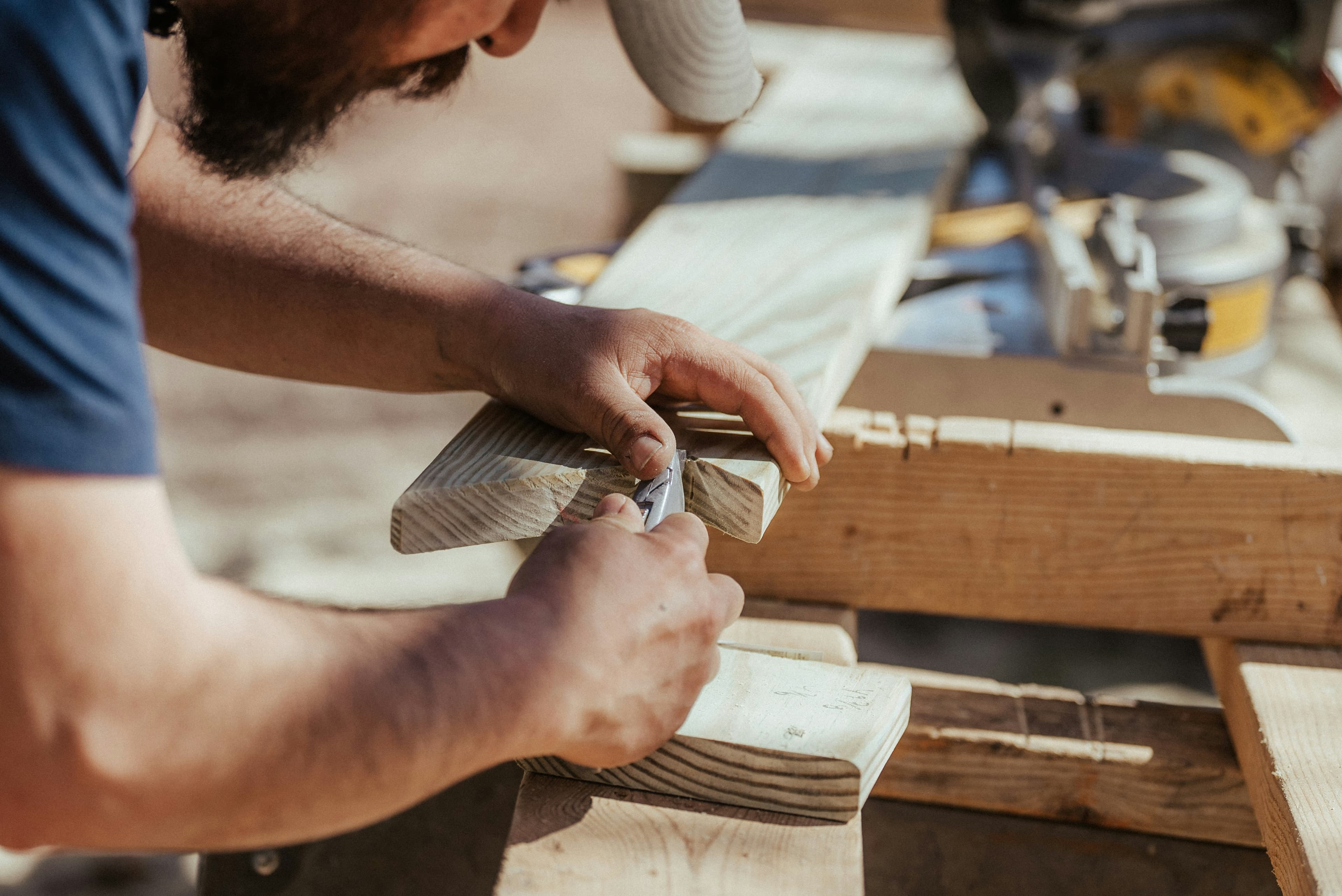 A man wood working with his hands